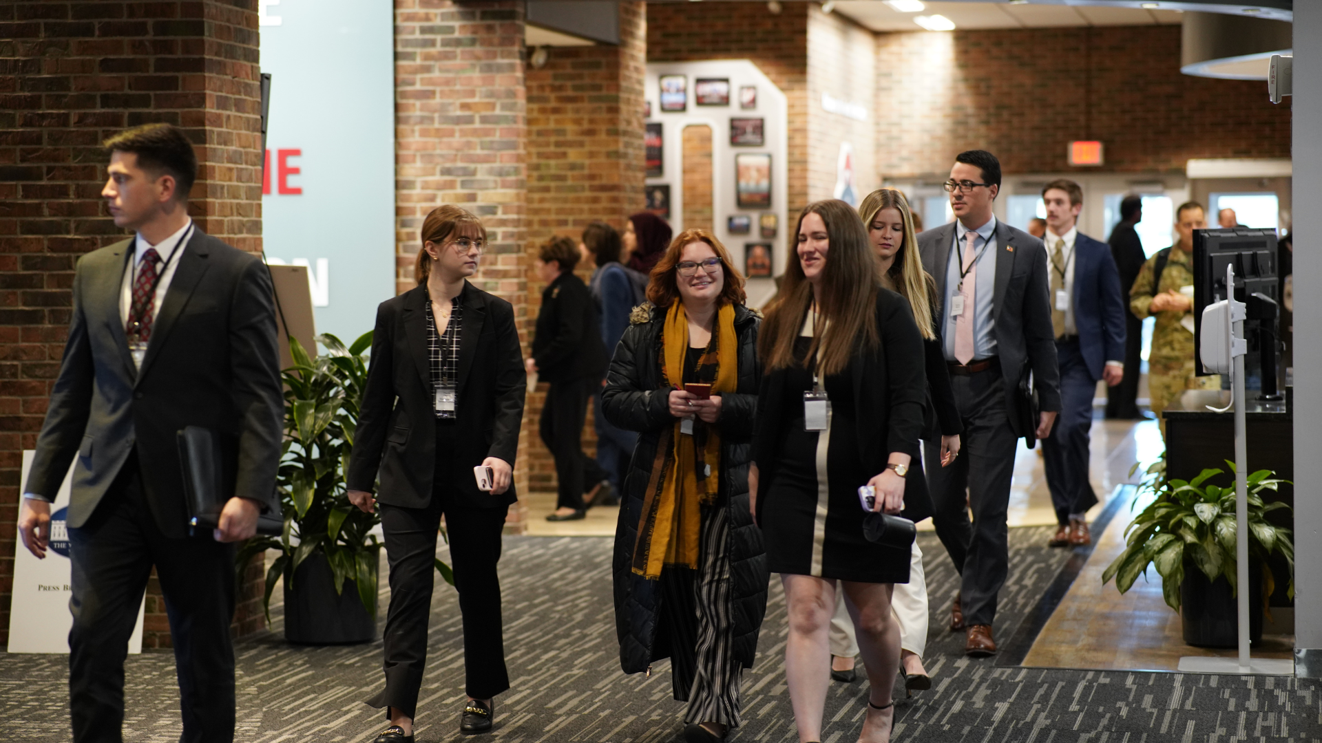 Students walking down a hallway during the National Security Simulation