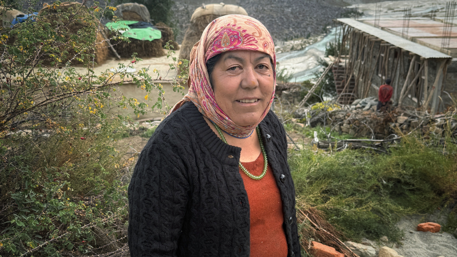 Woman smiling near the Chenab River