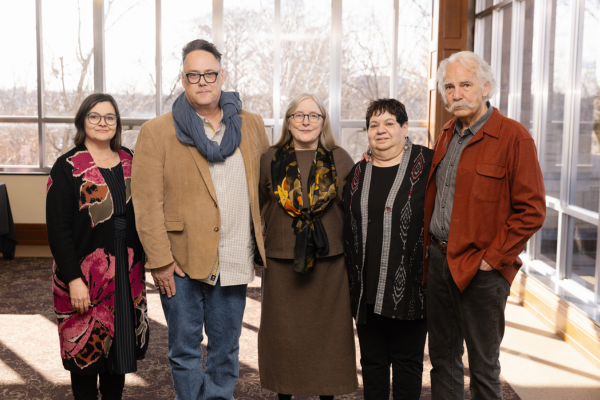 Group of 5 people posing for camera
