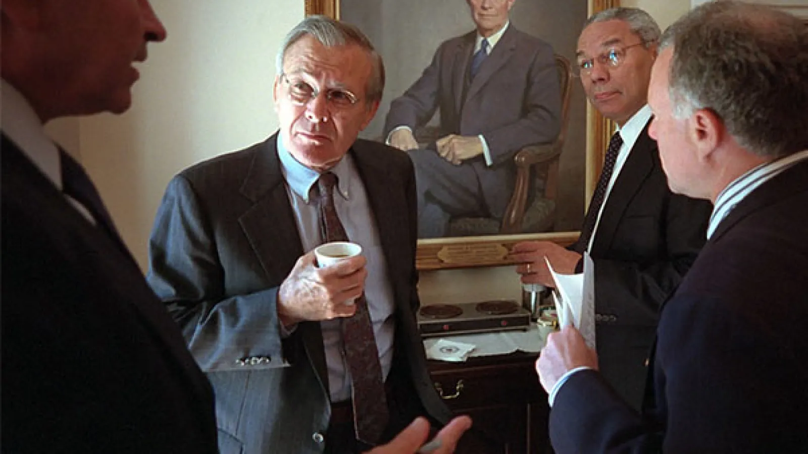 Defense Under Secretary Paul Wolfowitz talks with, from left, Donald Rumsfeld, Secretary of Defense; Colin Powell, Secretary of State, and Lewis Libby, Chief of Staff for the Vice President Wednesday, Sept. 12, 2001, in the Cabinet Room of the White House. Photo by Paul Morse, Courtesy of the George W. Bush Presidential Library 