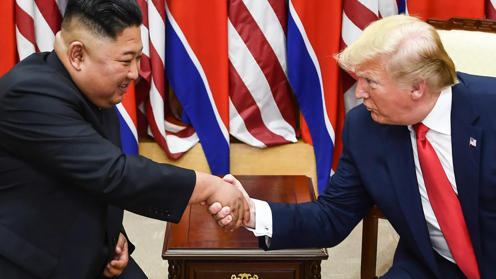 Kim Jung Un and Donald Trump shaking hands