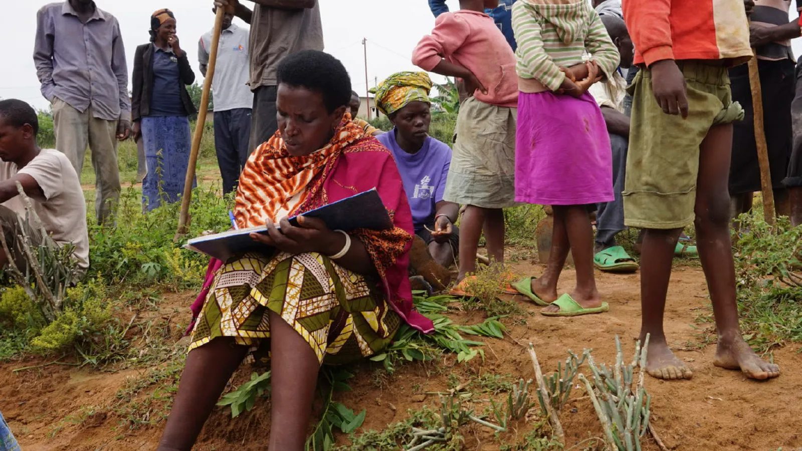 Residents work together on a drainage ditch in Mbyo, one of seven "reconciliation villages” where perpetrators and victims of the genocide in Rwanda live side by side, in April 2017. (Megan Specia/The New York Times)