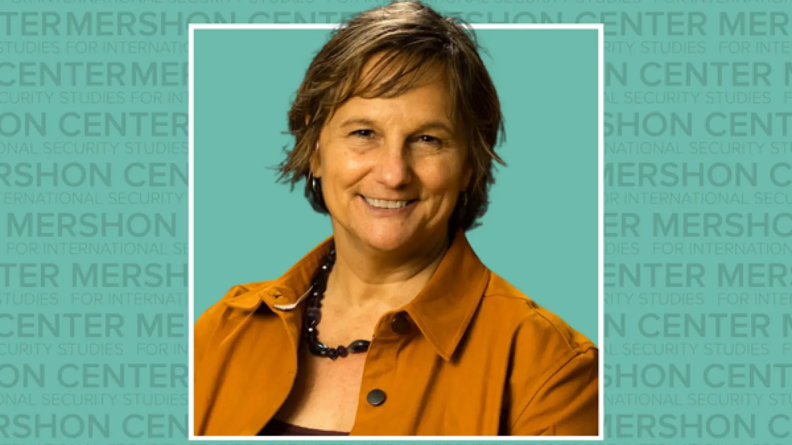 Photo of Laura Dugan with repeating Mershon Center text in background
