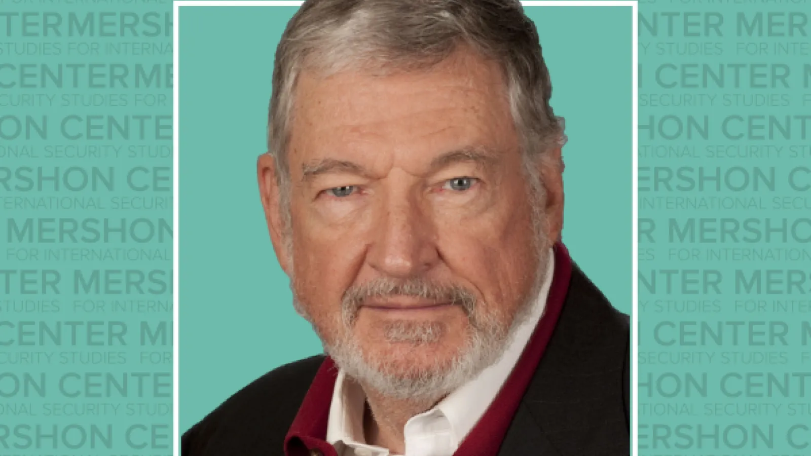 Photo of John Mueller with the repeating gray text Mershon Center on a teal background