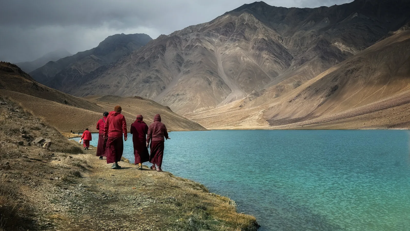 People walking on a river bank