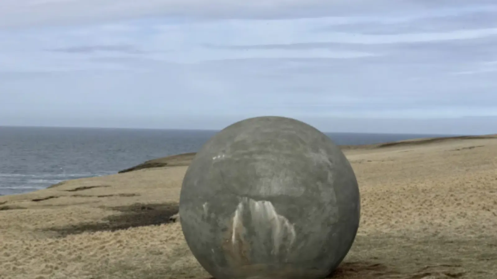 Large round rock on a beach
