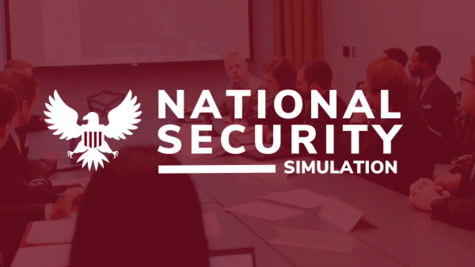 People at a conference table during the National Security Simulation