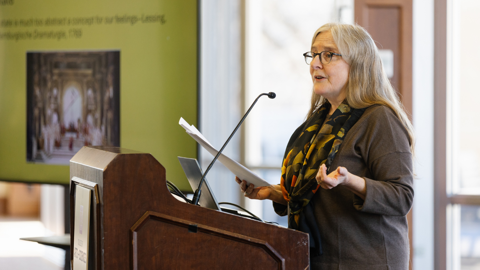 Dorothy Noyes speaking at a podium