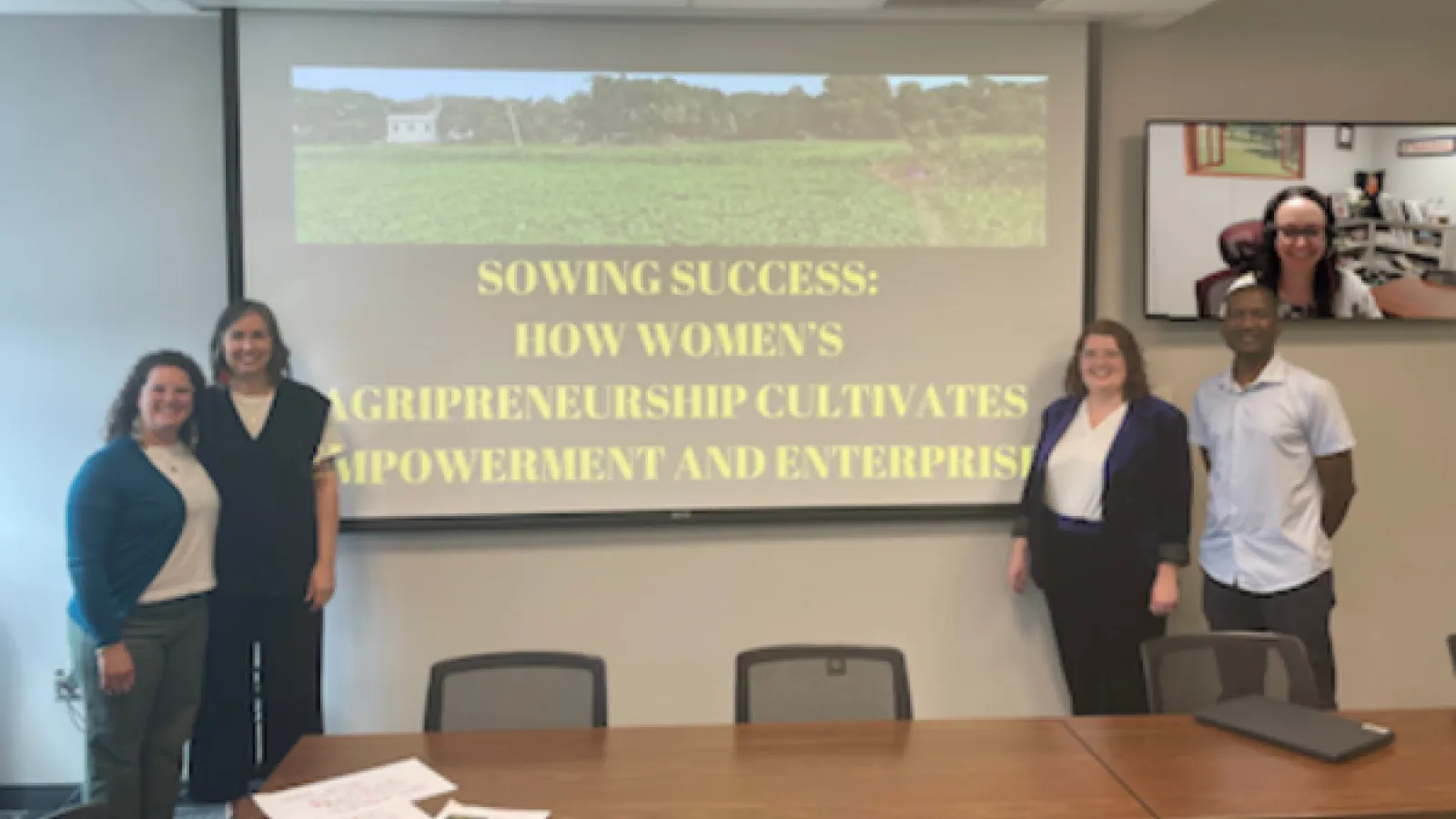 Group of people in front of presentation screen