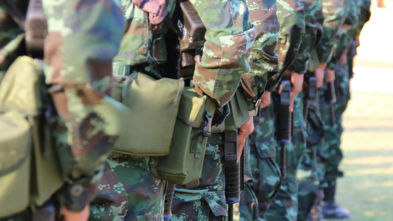 soldiers in camo uniforms
