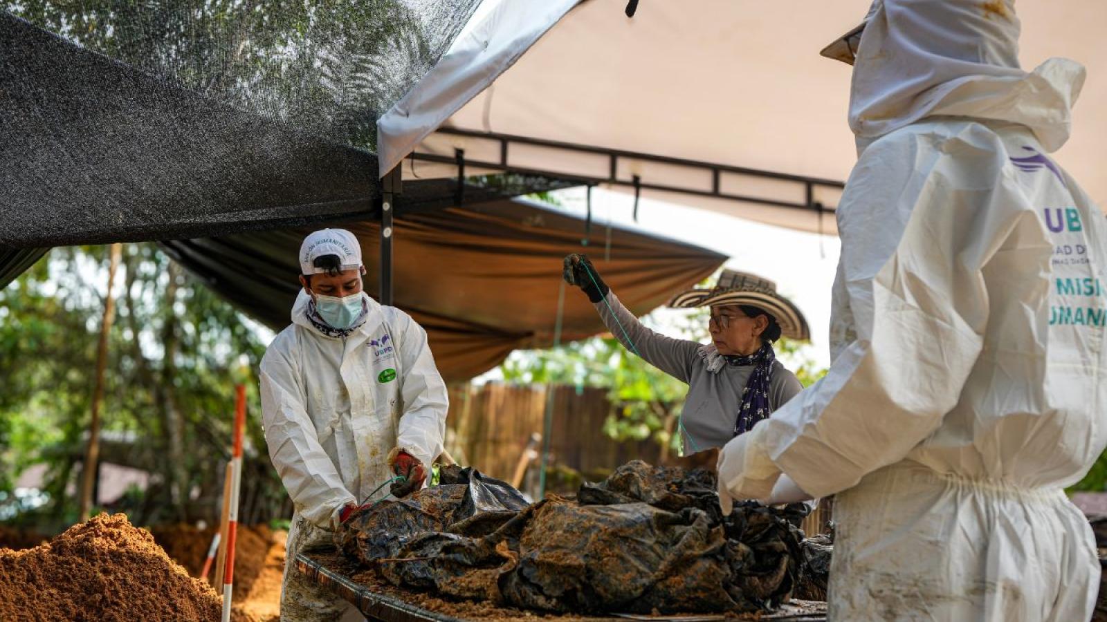 Forensic scientist exhuming remains