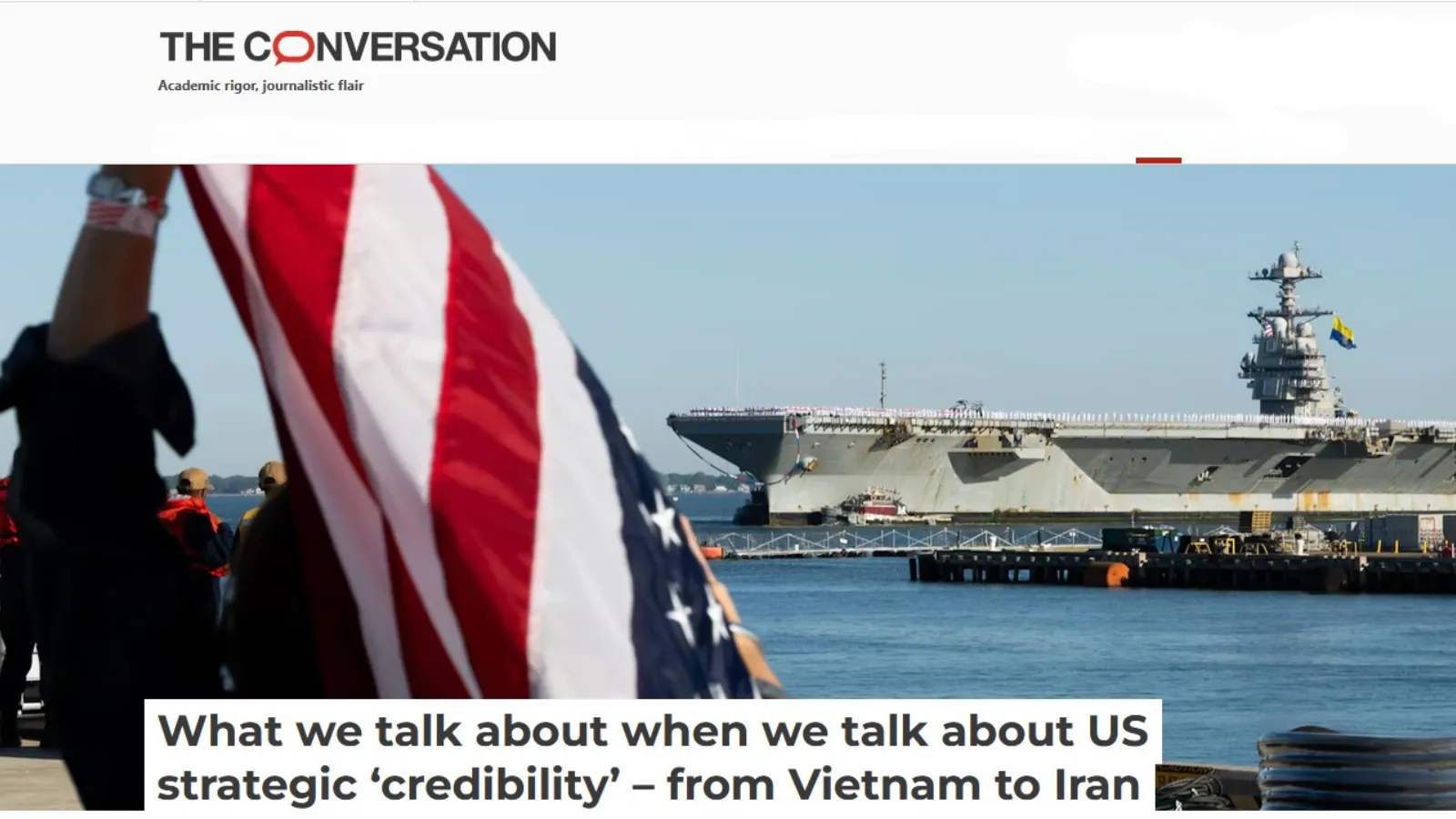 US tanker in the water and a American flag