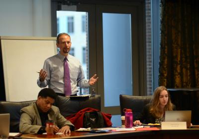 Dakota Rudesill introduces The Ohio State University National Security Simulation to participants.