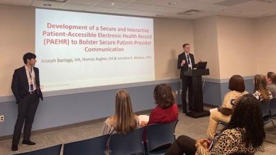 2 students making a presentation to an audience