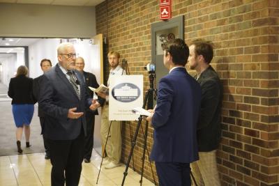 Man being interviewed by reporter