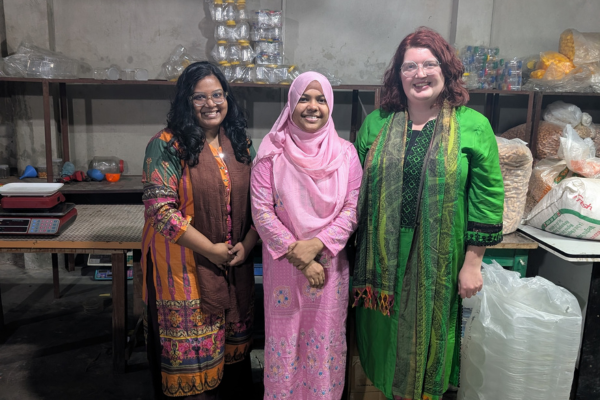 Three women at a food processor factory in Comilla, Bangladesh