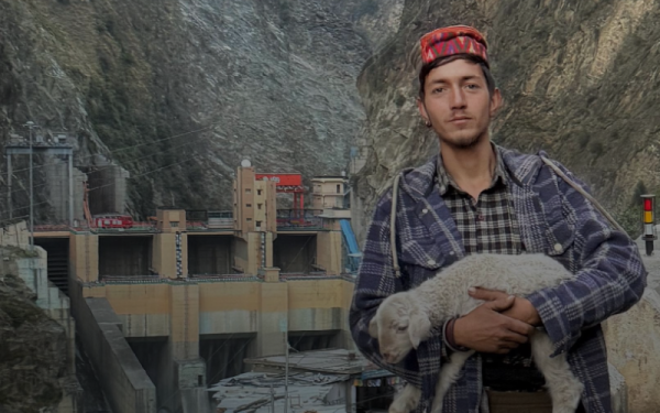 Young man holding a lamb