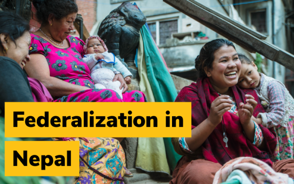 Women and children in Nepal laughing on outdoor staircase