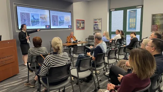 Fiona Cunningham presenting  to a room of people