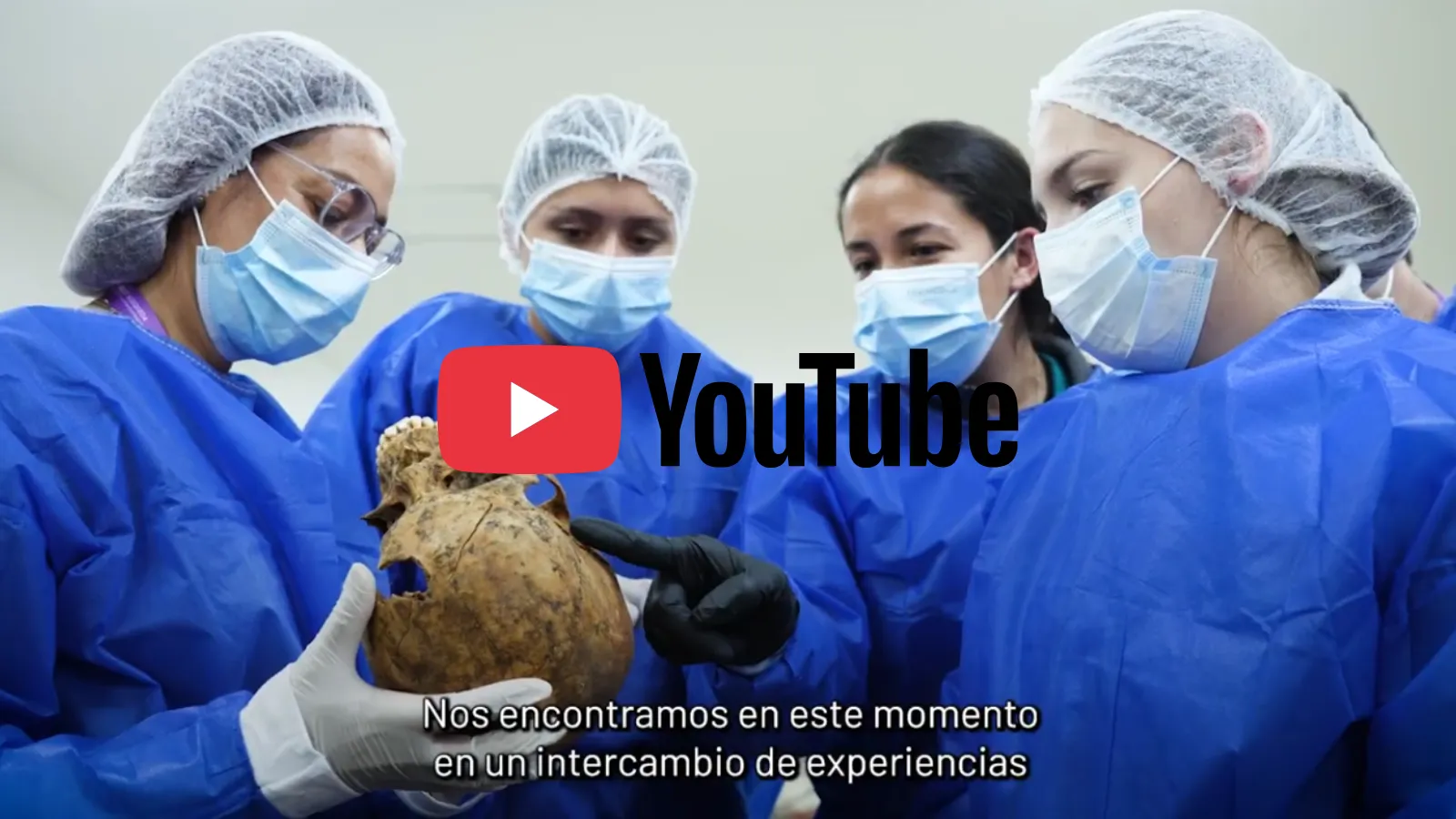UBPD forensic scientists in blue scrubs with skull