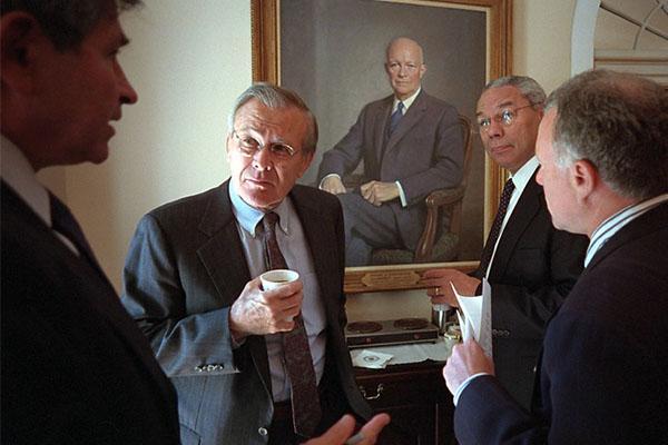 Defense Under Secretary Paul Wolfowitz talks with, from left, Donald Rumsfeld, Secretary of Defense; Colin Powell, Secretary of State, and Lewis Libby, Chief of Staff for the Vice President Wednesday, Sept. 12, 2001, in the Cabinet Room of the White House. Photo by Paul Morse, Courtesy of the George W. Bush Presidential Library 
