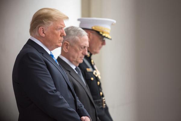 President Donald J. Trump, Secretary of Defense James N. Mattis and Chairman of the Joint Chiefs of Staff Marine Gen. Joseph F. Dunford Jr., bow their heads during a Memorial Day ceremony at Arlington National Cemetery in Arlington, Va., May 28, 2018. (DoD photo by Army Sgt. Amber I. Smith)