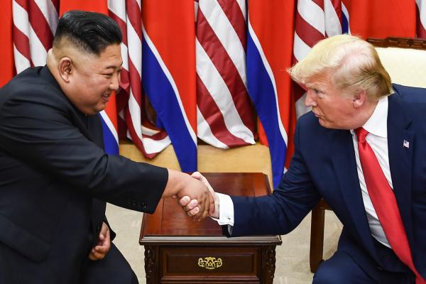 Kim Jung Un and Donald Trump shaking hands