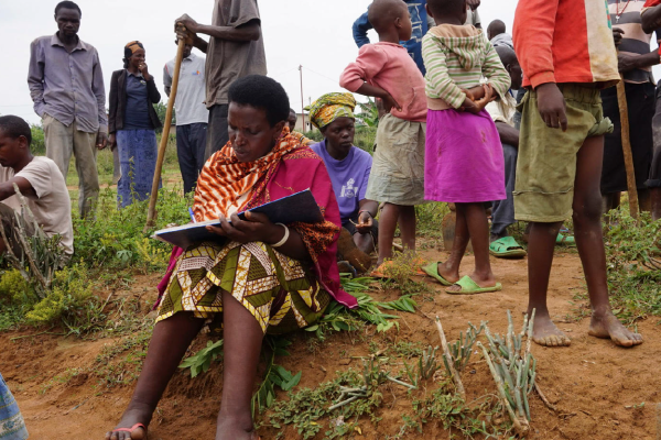 Residents work together on a drainage ditch in Mbyo, one of seven "reconciliation villages” where perpetrators and victims of the genocide in Rwanda live side by side, in April 2017. (Megan Specia/The New York Times)