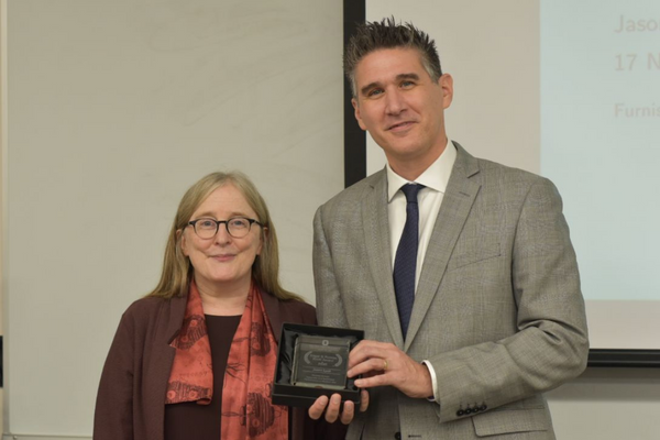 Jason Lyall and Dorothy Noyes, Lyall is holding the 2020 Furniss Book Award