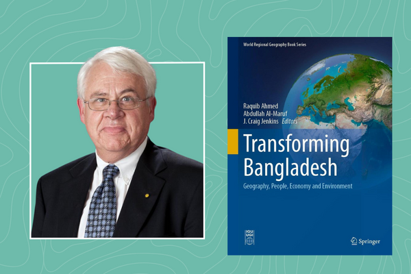 Photo of Craig Jenkins next to cover of book Transforming Bangladesh
