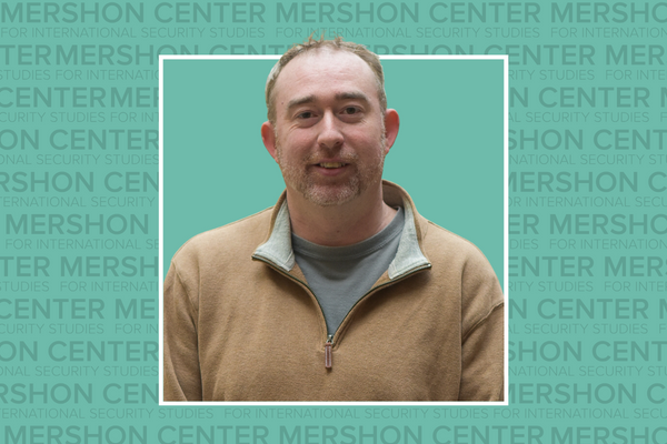 Photo of Brooks Marmon on a teal background that says Mershon Center for International Security Studies repeating