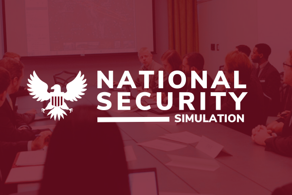 People at a conference table during the National Security Simulation