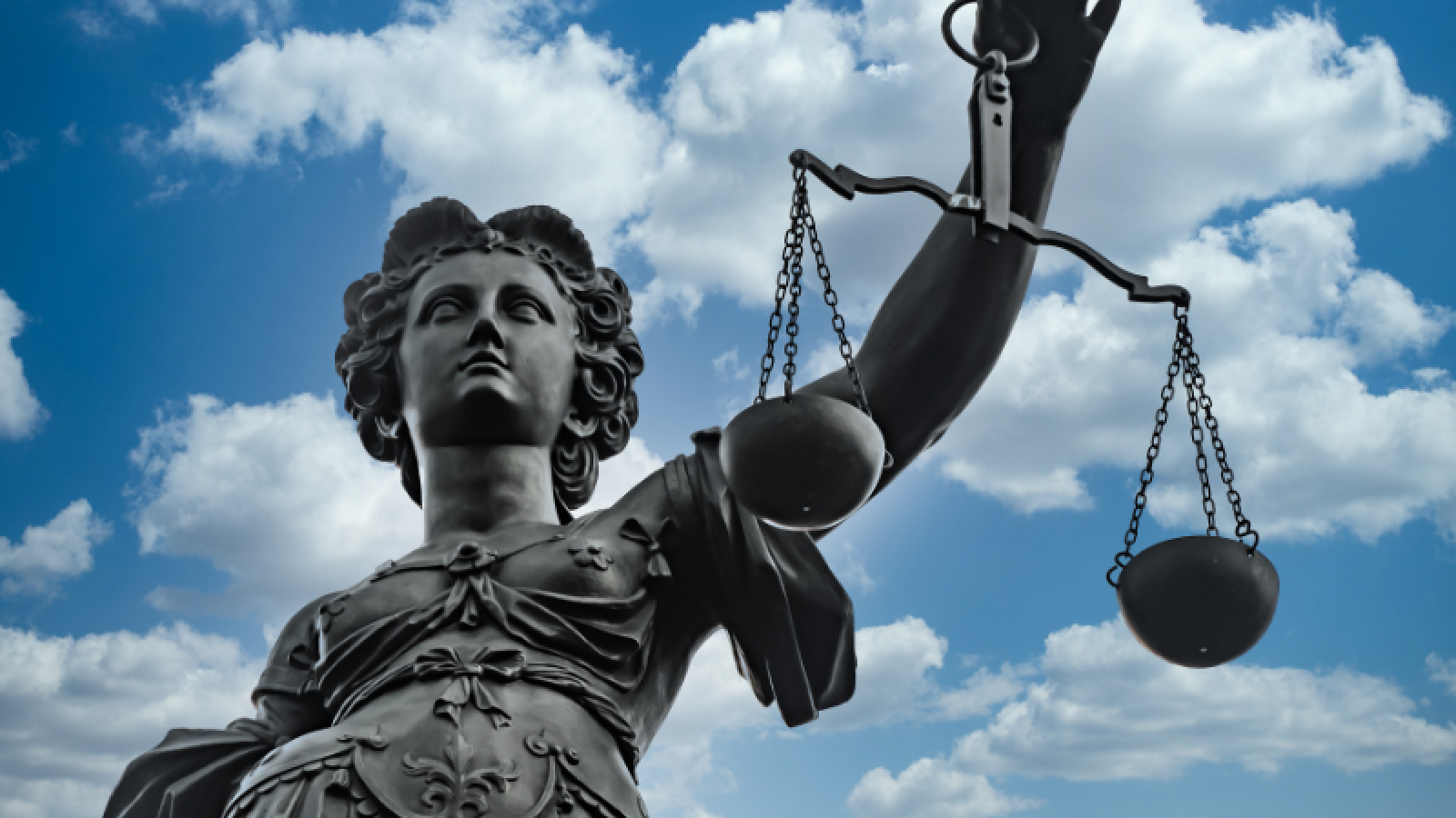 Sculpture of Lady Justice with even scales
